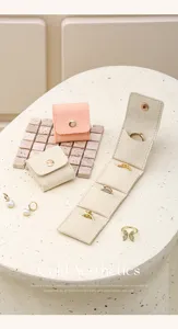 Portable microfiber travel jewelry organizer detail, ring and earring storage bag.