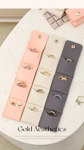 Detail view of portable multi-slot jewelry organizer bags showcasing rings storage.