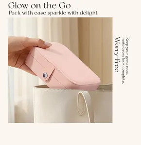Detailed view of the portable pink PU leather travel jewelry storage box packed easily.