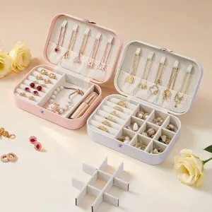Portable travel jewelry box organizer with double layers for rings, earrings and necklaces.