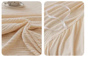 Jacquard velvet sofa cover detail, soft textured fabric texture and elastic corner straps close-up.