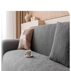 Detailed view of grey jacquard plush sofa cover, stretch slipcover for living room