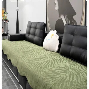 Green zebra print chenille sofa cover detail, modern minimalist living room furniture protector cushion.