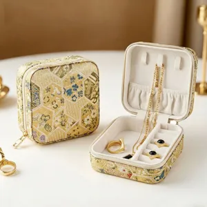 Gold retro Chinese style travel jewelry box with portable zipper design and velvet interior.