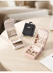 Portable mini jewelry box travel PU leather storage organizer for rings necklaces earrings.