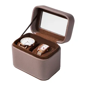 Scatola per orologi doppia in pelle con finestra trasparente e interno in morbido velluto marrone.