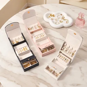 Portable travel jewelry box organizer for rings earrings necklaces. Multi-color storage case.