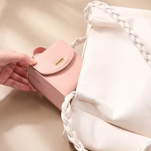 Portable travel mini jewelry box for rings earrings necklaces, pink leather organizer case.