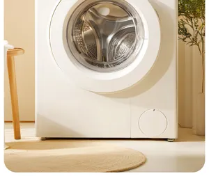 Modern front load washing machine in elegant white with large glass door for home laundry use.