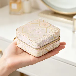 Portable Chinese style mini jewelry box for rings, earrings and necklaces, compact travel case.