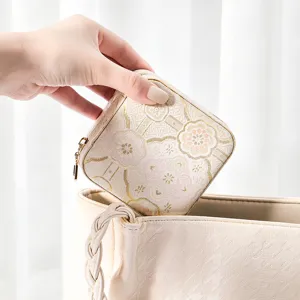 Portable Chinese style mini jewelry box travel case for rings, earrings and necklaces.