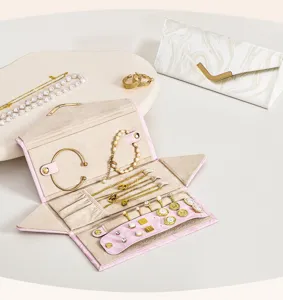 Portable folding jewelry organizer box for travel, neat necklace, ring, earring storage.