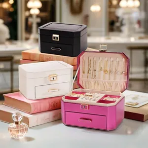 Double layer PU leather jewelry box with compartments for necklaces, rings, and earrings.