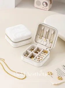 Portable white marble jewelry box with soft velvet lining for rings, earrings and necklaces.