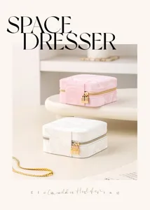 Close-up of portable leather jewelry box with marble pattern and golden lock details.