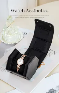 Black leather single travel watch box with soft interior lining and delicate quartz wristwatch.