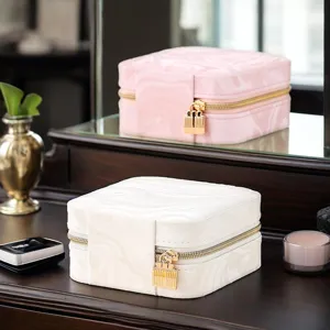 Portable marble pattern square jewelry box with lock design, elegant travel storage case for rings.
