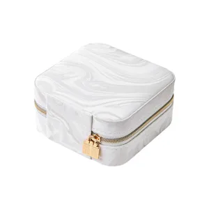 Portable square jewelry box with white marble pattern, gold zipper and lock pendant for travel.