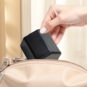 Portable black leather watch box, hexagon travel storage case for luxury watches and jewelry.