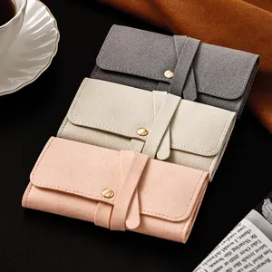 Portable mini velvet jewelry organizer pouch for rings, earrings and small accessories.