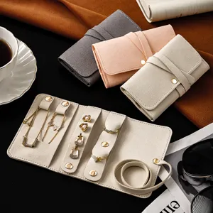 Portable velvet jewelry organizer mini travel storage bag for rings earrings and necklaces.