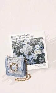 Portable retro jacquard mini headphone storage bag with chic gold chain and round metal buckle.