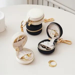 Detail view of the portable mini travel jewelry box with secure zipper and soft velvet lining.