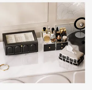 Black leather jewelry box with glass lid and arch design, elegant desktop organizer for rings.