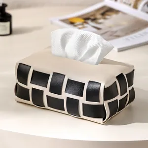 Luxury leather tissue box with black and beige woven checkerboard design for home decor.