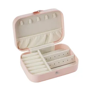 Portable pink PU leather travel jewelry box with ring rolls and necklace hooks for women.