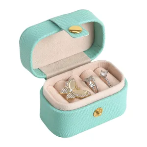 Portable mini PU leather jewelry box for rings and earrings, mint green travel storage case.