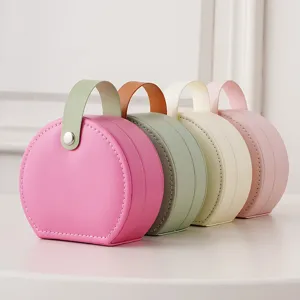 Portable round leather jewelry storage box travel mini organizer for rings earrings studs.