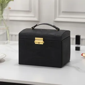 Portable black PU leather jewelry box with handle and gold lock for rings, earrings and necklaces.