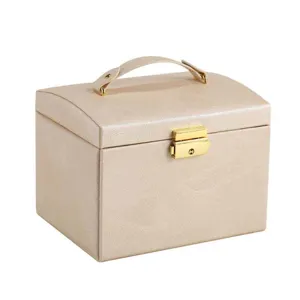 Champagne PU leather jewelry box with handle and gold lock, portable organizer for rings.
