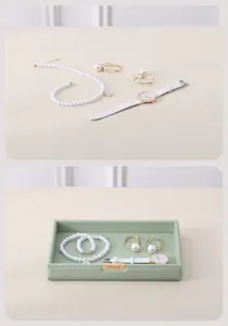 Elegant pearl necklace, earrings, watch set with green leather jewelry storage tray.