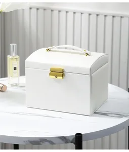 Elegant white PU leather jewelry box detail showcasing premium gold lock and convenient top handle.