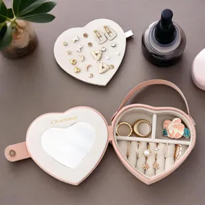 Heart-shaped jewelry box with mirror, portable handle, ideal Valentine gift for rings, earrings.