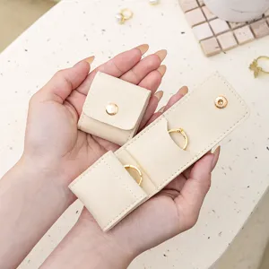 Portable microfiber travel jewelry organizer pouch for rings earrings necklaces storage bag.