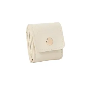 Portable microfiber travel jewelry storage bag for rings, earrings, and necklaces, beige.