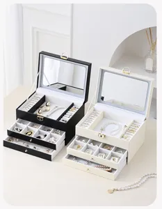 Multi-layer jewelry box with mirror, large capacity organizer for rings and necklaces.