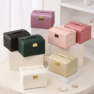 Multi-layer PU leather jewelry box with handle, large capacity storage for rings and earrings.