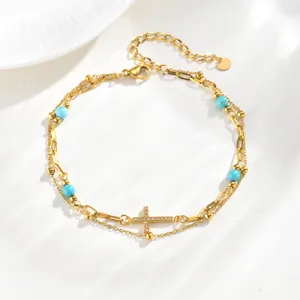 Details view of the 18K gold stainless steel double layer turquoise zircon cross anklet.