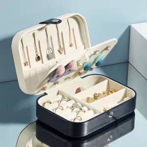 Portable double-layer jewelry organizer box for earrings, necklaces, rings and small accessories.