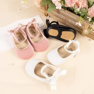 Infant velvet princess shoes with bow detail, soft sole design for baby girls toddler walking.