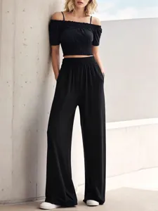 Women black off-shoulder crop top and wide-leg pants set detail view fashion outfit