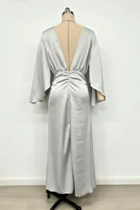 Elegant silver satin evening gown with deep V back, high waist pleated dress for party.