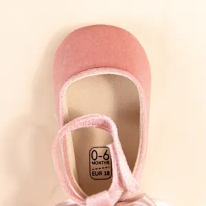 Pink velvet baby shoe detail, soft sole infant toddler princess shoe with cute bow, size 0-6M.