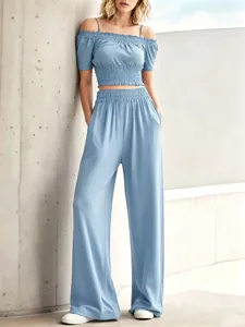 Women casual off-the-shoulder crop top and wide leg pants set, stylish light blue outfit.