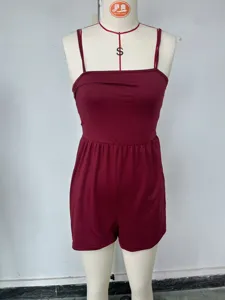Detailed view of burgundy strapless romper with thin straps and elastic waist design.