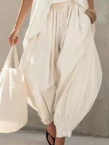 Cotton linen sleeveless outfit detail, loose irregular vest with cuffed lantern pants for women.